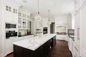 Clean design contrasting dark island and white wall cabinets in this recent Freehold renovation project.