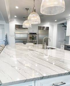 Remodeled kitchen in Robbinsville featuring full white Quartzite slab and matching Subzero appliances.