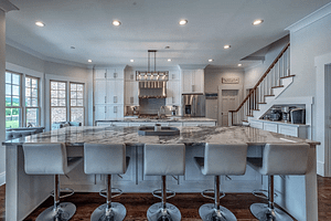 Large home remodel project featuring full marble slab kitchen islands to captivate Bay Head guests.