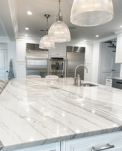 Remodeled kitchen in Cream Ridge featuring full white Quartzite slab and matching Subzero appliances.
