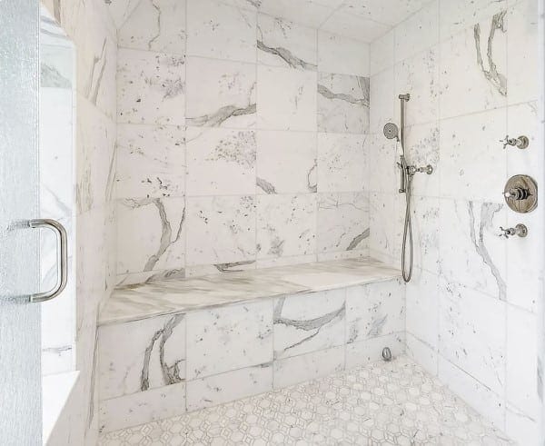 Beautiful Calacatta marble installed floor to ceiling in this beautiful master bathroom shower retreat.